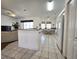 Kitchen with white cabinets, tile floor, and breakfast area at 17820 Monteverde Dr, Spring Hill, FL 34610