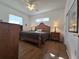 Main bedroom with king-size bed, wood furniture, and window views at 17820 Monteverde Dr, Spring Hill, FL 34610