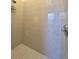 Clean and spacious walk-in shower with neutral tile at 17820 Monteverde Dr, Spring Hill, FL 34610