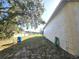 Side yard with a water tank and hose at 17820 Monteverde Dr, Spring Hill, FL 34610