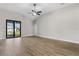 Bright and airy living room with a ceiling fan, and sliding doors leading to the outdoor space at 4570 Gillot Blvd, Port Charlotte, FL 33981