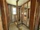 Unfinished bathroom with exposed plumbing and framing at 519 79Th Ave, St Pete Beach, FL 33706