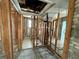 Unfinished bathroom with exposed plumbing and framing at 519 79Th Ave, St Pete Beach, FL 33706