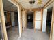 Unfinished bedroom with exposed framing and flooring at 519 79Th Ave, St Pete Beach, FL 33706