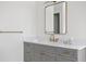 Clean bathroom with gray vanity, white countertop, and gold fixtures at 4835 W San Jose St, Tampa, FL 33629