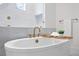 Elegant bathroom showcasing a freestanding tub and marble accents at 4835 W San Jose St, Tampa, FL 33629