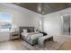 Bright bedroom featuring a comfy bed, wood flooring, and natural light at 4835 W San Jose St, Tampa, FL 33629