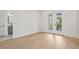 Light and bright bedroom with hardwood floors and access to a private balcony at 4835 W San Jose St, Tampa, FL 33629