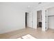 Spacious bedroom with light hardwood floors and an ensuite bathroom at 4835 W San Jose St, Tampa, FL 33629