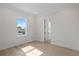 Bright bedroom featuring hardwood floors and an adjacent door at 4835 W San Jose St, Tampa, FL 33629