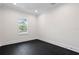 Bright bedroom with large window and dark flooring at 4835 W San Jose St, Tampa, FL 33629
