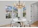 Breakfast nook features a round table, four chairs, and an abundance of natural light at 4835 W San Jose St, Tampa, FL 33629