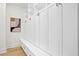 White built-in shelving and drawers with gold hardware at 4835 W San Jose St, Tampa, FL 33629