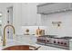Modern kitchen features with stainless steel range and gold fixtures at 4835 W San Jose St, Tampa, FL 33629