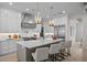 Modern kitchen with island, white cabinets, and gold accents at 4835 W San Jose St, Tampa, FL 33629