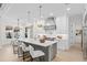Modern kitchen with white cabinets, island seating, and high-end finishes at 4835 W San Jose St, Tampa, FL 33629