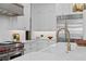 Luxury kitchen with stainless steel appliances and white cabinetry at 4835 W San Jose St, Tampa, FL 33629