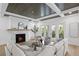 Living area features a fireplace, hardwood floors, and access to balcony at 4835 W San Jose St, Tampa, FL 33629