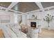 Living room boasts a fireplace, hardwood floors, and stylish decor at 4835 W San Jose St, Tampa, FL 33629