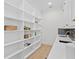 Well-organized pantry with floor-to-ceiling shelving, offering generous storage space at 4835 W San Jose St, Tampa, FL 33629