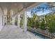 Outdoor patio with built-in grill, pool, and lush landscaping at 4835 W San Jose St, Tampa, FL 33629