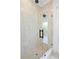Spa-like shower with light beige tile and a frameless glass enclosure at 4835 W San Jose St, Tampa, FL 33629
