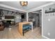 Modern kitchen with gray cabinets and breakfast bar, open to living room at 1619 Coppertree Dr, Tarpon Springs, FL 34689