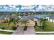 Property view showcasing home's location near a lake in a residential community at 649 Chipper Dr, Sun City Center, FL 33573