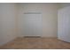 Spacious bedroom with double door closet and tile flooring at 649 Chipper Dr, Sun City Center, FL 33573