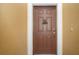 Brown front door with decorative accents at 649 Chipper Dr, Sun City Center, FL 33573