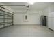 Garage with overhead door and extra storage at 649 Chipper Dr, Sun City Center, FL 33573