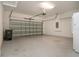 Garage with overhead door and extra storage at 649 Chipper Dr, Sun City Center, FL 33573