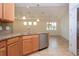 View of kitchen with stainless steel appliances and light tile floor at 649 Chipper Dr, Sun City Center, FL 33573