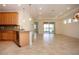 Kitchen features granite countertops and light wood cabinets at 649 Chipper Dr, Sun City Center, FL 33573