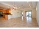 Kitchen features granite countertops and light wood cabinets at 649 Chipper Dr, Sun City Center, FL 33573