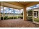 Enjoy the view from this screened porch, overlooking a lake at 649 Chipper Dr, Sun City Center, FL 33573