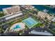 Aerial view of community with tennis courts and waterfront access at 7625 Sun Island S Dr # 101, South Pasadena, FL 33707