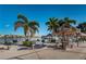 Community BBQ area with multiple grills and picnic tables at 7625 Sun Island S Dr # 101, South Pasadena, FL 33707