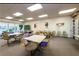 Community game room with tables and chairs, perfect for socializing at 7625 Sun Island S Dr # 101, South Pasadena, FL 33707