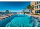 Inviting community pool with waterfront views and ample deck space at 7625 Sun Island S Dr # 101, South Pasadena, FL 33707