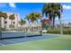 Well-maintained tennis and pickleball courts with waterfront views at 7625 Sun Island S Dr # 101, South Pasadena, FL 33707