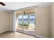 Waterfront view from condo with sliding glass doors leading to a screened patio at 7625 Sun Island S Dr # 101, South Pasadena, FL 33707
