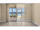 Waterfront view from condo with sliding glass doors leading to a screened patio at 7625 Sun Island S Dr # 101, South Pasadena, FL 33707