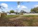 Spacious backyard, partially fenced, and offering a large grassy area at 8816 Ashman Rd, Riverview, FL 33578