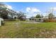 Large backyard with grassy area and partially fenced at 8816 Ashman Rd, Riverview, FL 33578