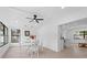 Bright dining area with white table and chairs, adjacent to kitchen at 8816 Ashman Rd, Riverview, FL 33578