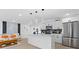 Modern kitchen with white cabinets, quartz countertops, and stainless steel appliances at 8816 Ashman Rd, Riverview, FL 33578