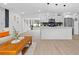 Open concept living room and kitchen with light floors and modern decor at 8816 Ashman Rd, Riverview, FL 33578