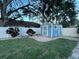 Landscaped backyard with a storage shed and fenced area at 2353 Kilgore Dr, Largo, FL 33770