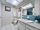 Bathroom with blue tile and updated vanity at 2353 Kilgore Dr, Largo, FL 33770